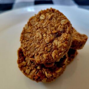 A close up of three cookies on a plate